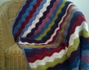 Multi-coloured striped chevron lap blanket