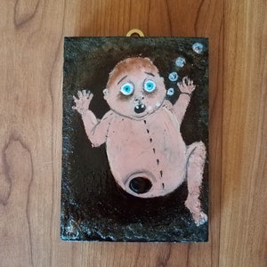 Little creepy baby doll missing a leg. Hand painted on reclaimed wood with textured edging