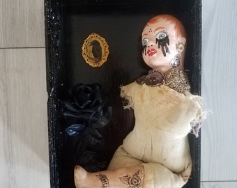 Second hand Rose&#39;, old creepy doll with hand painted head in reclaimed wood box, assemblage art piece