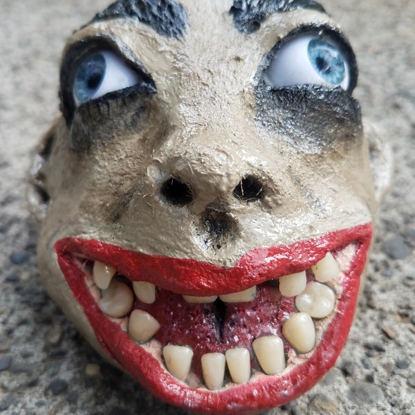 Creepy gargoyle head garden, house ornament. Sculpted from weather resistant clay, resin teeth and real like eyes