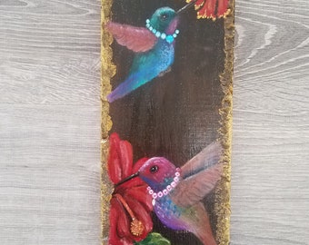 Hummingbirds wearing gem necklaces with red flowers. Hand painted original on reclaimed wood