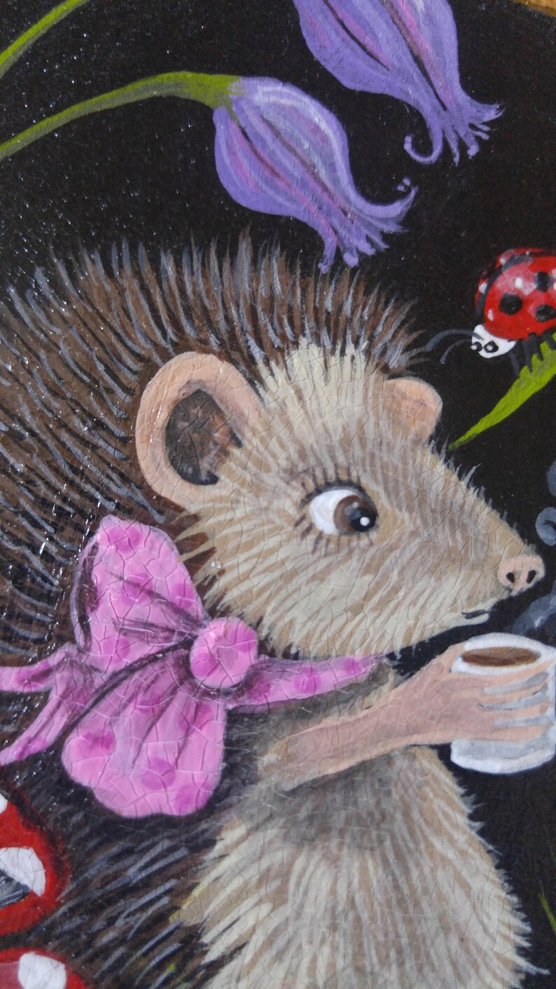 Hedgehog drinking a cup of tea sitting amongst magic mushrooms and bluebells Hand painted on decorative wood piece