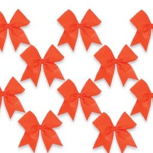May include: Ten orange satin hair bows with a large, double loop design. The bows are approximately 4 inches in diameter.