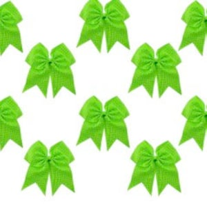 May include: Ten lime green hair bows with a checkered pattern. The bows are arranged in three rows.
