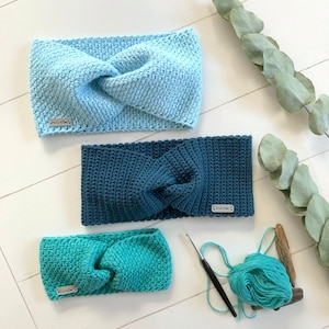 May include: Three crocheted headbands in different shades of blue and green. The headbands are made with a twisted knot design and have a small label with the text "Wool Addict" on each.
