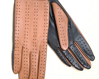 May include: A pair of leather gloves in a brown and black colour scheme. The gloves feature a perforated design and are made from soft, supple leather.