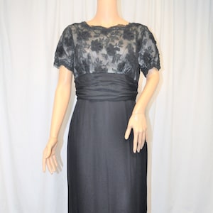 Vintage 1950s black crepe and lace cocktail dress with straight skirt and lace underlined bodice image 1