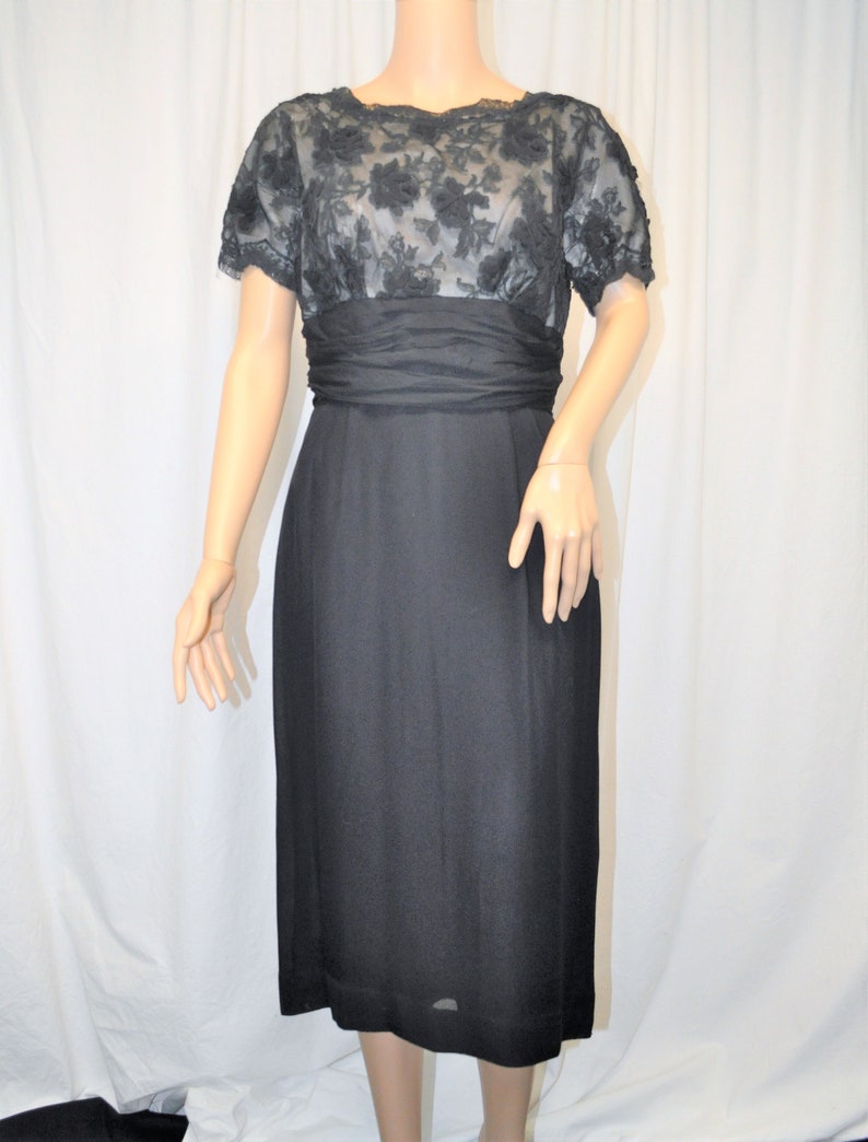 Vintage 1950s black crepe and lace cocktail dress with straight skirt and lace underlined bodice image 1