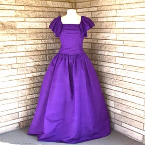 Vintage 1980s 1990s deep purple taffeta evening gown with ruffle sleeves, back bow, and built in crinoline