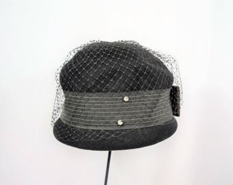 Vintage 1960s black cloche bucket top hat with ribbon trim, veiling and rhinestone accents Henry Pollack union made