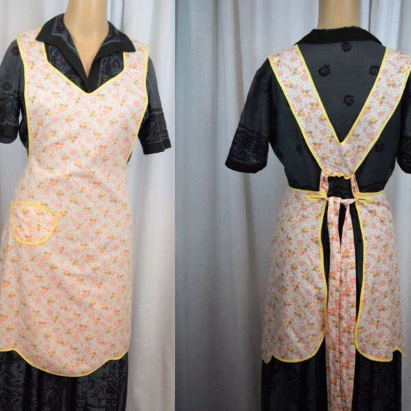 Vintage 1940s 1950s full length bib front kitchen apron pink and yellow print, yellow binding trim