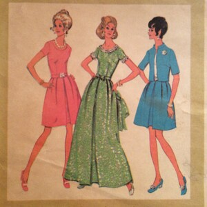 May include: Vintage fashion illustration featuring three women in dresses. The dresses are in pink, green, and blue. The pink dress is short with a belt. The green dress is a long gown. The blue dress is short with a jacket.