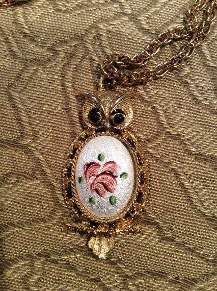 Vintage owl necklace  goldtone with enameled centerpiece of pink flowers and green leaves on a white