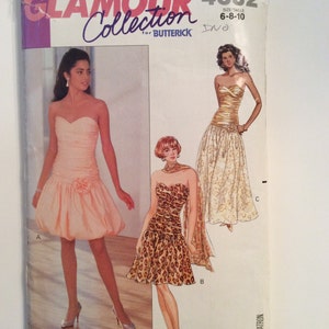 May include: A vintage sewing pattern for a dress, featuring three different styles. The pattern is for sizes 6-8-10 and is from the Glamour Collection for Butterick. The pattern shows three different styles of dresses, one with a pink skirt, one with a leopard print skirt, and one with a gold skirt.