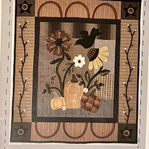 May include: A white ceramic mug with a black handle and the text "But First, Coffee" in a black, bold font. The mug is on a white surface.