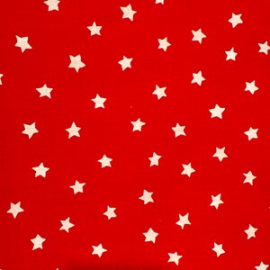 May include: A vibrant red fabric with a repeating pattern of white, five-pointed stars. The stars are evenly spaced across the surface, creating a playful and eye-catching design. This textile is suitable for various crafting and sewing projects.