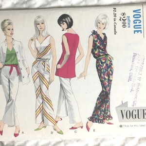 May include: A vintage Vogue sewing pattern with illustrations of five outfits. The designs include jumpsuits, dresses, and separates. The cover features the Vogue logo and sizing details. Measurements are in inches.