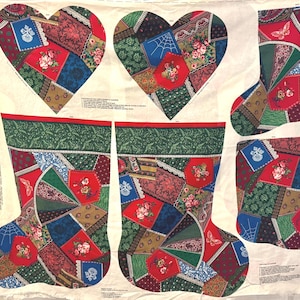 May include: A fabric panel featuring two heart shapes and four Christmas stocking shapes. The shapes are made of patchwork fabric in various colors, including red, green, blue, and brown. Floral and geometric patterns are visible.