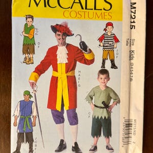 May include: McCall's Costumes pattern M7215 for kids, featuring illustrations of pirate and other costume designs. The pattern includes images of a red coat, a pirate hat, and other costume elements. The size range is for kids aged 3-8.