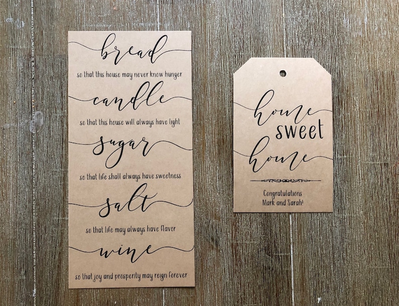 May include: Two brown paper cards with black calligraphy. The larger card has the words "bread", "candle", "sugar", "salt", and "wine" with a short phrase about each word. The smaller card has the words "home sweet home" and the text "Congratulations Mark and Sarah!"