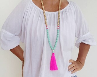 Neon Pink beaded tassel necklace - Long boho wooden bead tassel necklace with teal resin feature beads and pink tassel
