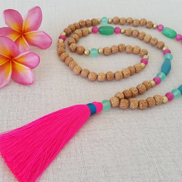 Long hot pink and wood statement tassel necklace with teal and turquoise, mint and pink resin feature beads and neon pink tassel