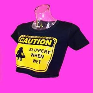 May include: Black cropped t-shirt with a yellow caution sign that says "CAUTION SLIPPERY WHEN WET".
