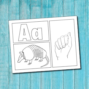 May include: Black and white coloring page featuring the letter A, the word "Aa", an armadillo, and an illustration of the American Sign Language sign for the letter A.