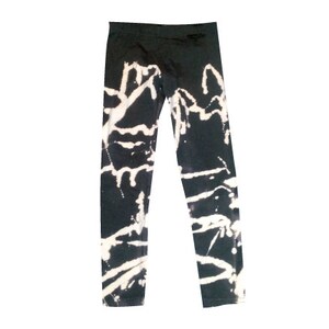 May include: Black leggings with a white bleach splatter design.