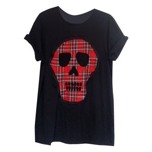 May include: Black t-shirt with a red and black tartan skull design.