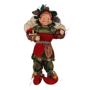 May include: A green and red Christmas elf figurine with a holly wreath on its head, gold wings, and bells on its pants.
