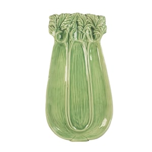 May include: A green ceramic serving dish shaped like a bunch of celery. The dish has three sections and is perfect for serving snacks or appetizers.