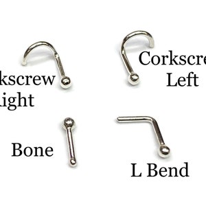 May include: Four different styles of nose rings: corkscrew right, corkscrew left, bone, and L bend. All are silver in color.