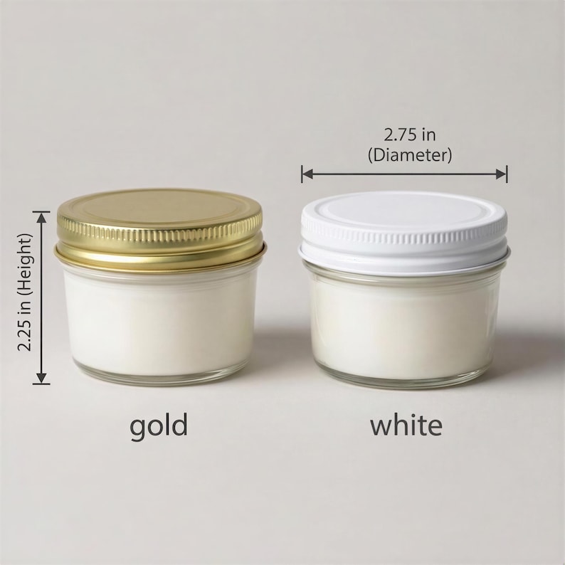 two small glass jars with lids, one labeled "gold" and the other "white", placed side by side. The jars appear to be made of glass and have a similar appearance.