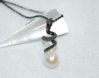 White Baroque Pearl Snake with Ruby Eyes Oxidized Silver Necklace
