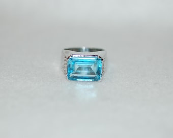 Bold Emerald Cut Blue Topaz Cocktail Ring