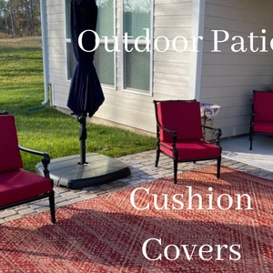 May include: Red outdoor patio cushions on black metal chairs with a red and white patterned rug. The text "Outdoor Patio Cushion Covers" is visible in the image.