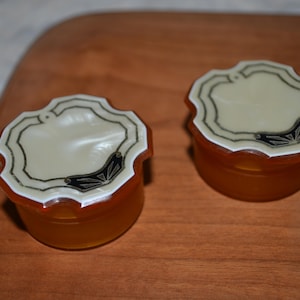 Two Vintage Celluloid Glass Lined Rouge Pots