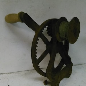 Antique cast iron wire roller