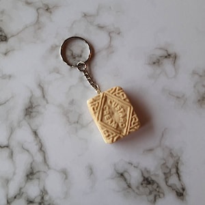 Custard cream biscuit keyring. Cute quirky kawaii funny unusual keyring