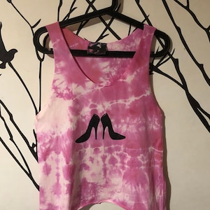 May include: Pink tie-dye tank top with a black silhouette of a pair of high heels on the front.