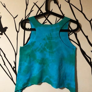 May include: A blue and green tie-dye tank top with a slightly asymmetrical hem.