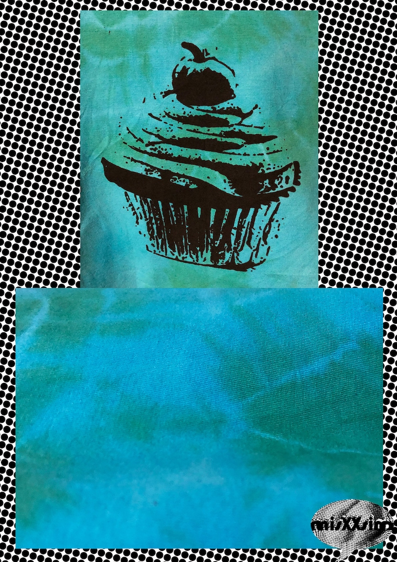 May include: A teal blue tie-dye fabric with a black and white silhouette of a cupcake with a cherry on top.