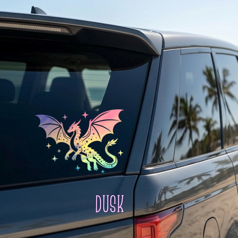 May include: A colorful dragon sticker with a rainbow gradient design, including pink, yellow, and blue hues. The sticker is applied to a car window, with the word "DUSK" in a matching color scheme below the dragon.