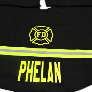 Firefighter Christmas Tree Skirt in Black Fabric and Neon Yellow Reflective Tape with Maltese cross and name added.