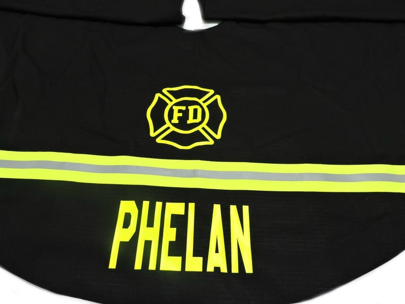 Firefighter Christmas Tree Skirt in Black Fabric and Neon Yellow Reflective Tape with Maltese cross and name added.