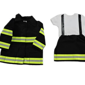 May include: A child's firefighter costume set, featuring a black jacket with reflective yellow-green stripes and a matching pair of pants with suspenders. The set includes a white t-shirt. The jacket has pockets and a collar.