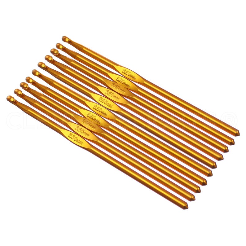 May include: A set of ten gold-colored crochet hooks. The hooks are arranged in a fan shape, with the largest hook at the top and the smallest hook at the bottom. Each hook is labeled with its size in millimeters.