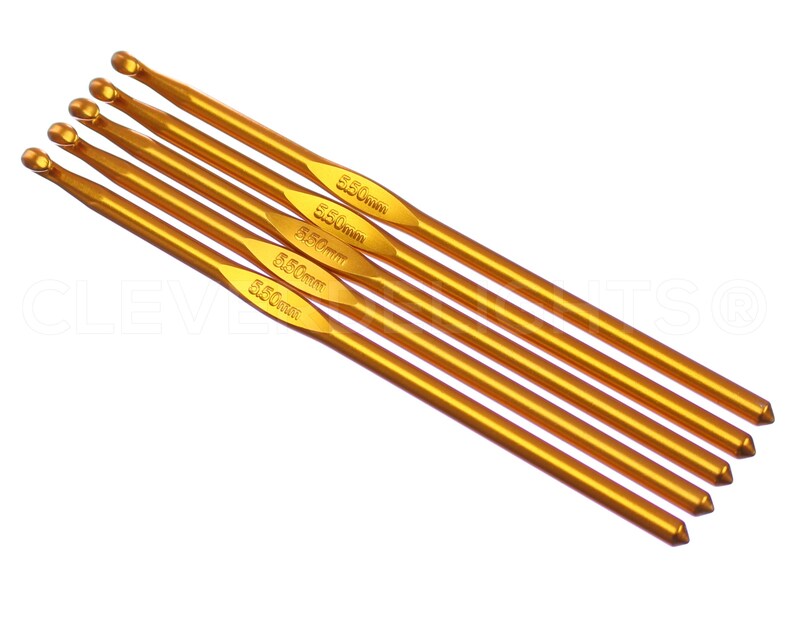 May include: Set of five gold crochet hooks, each with a different size marked in millimeters: 2.50mm, 3.50mm, 4.50mm, 5.50mm, and 6.50mm.