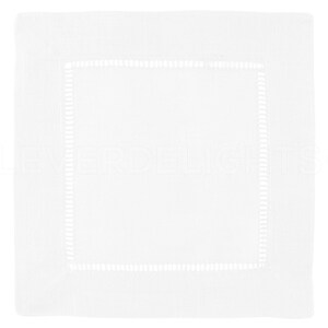 May include: White linen napkin with a white embroidered border.